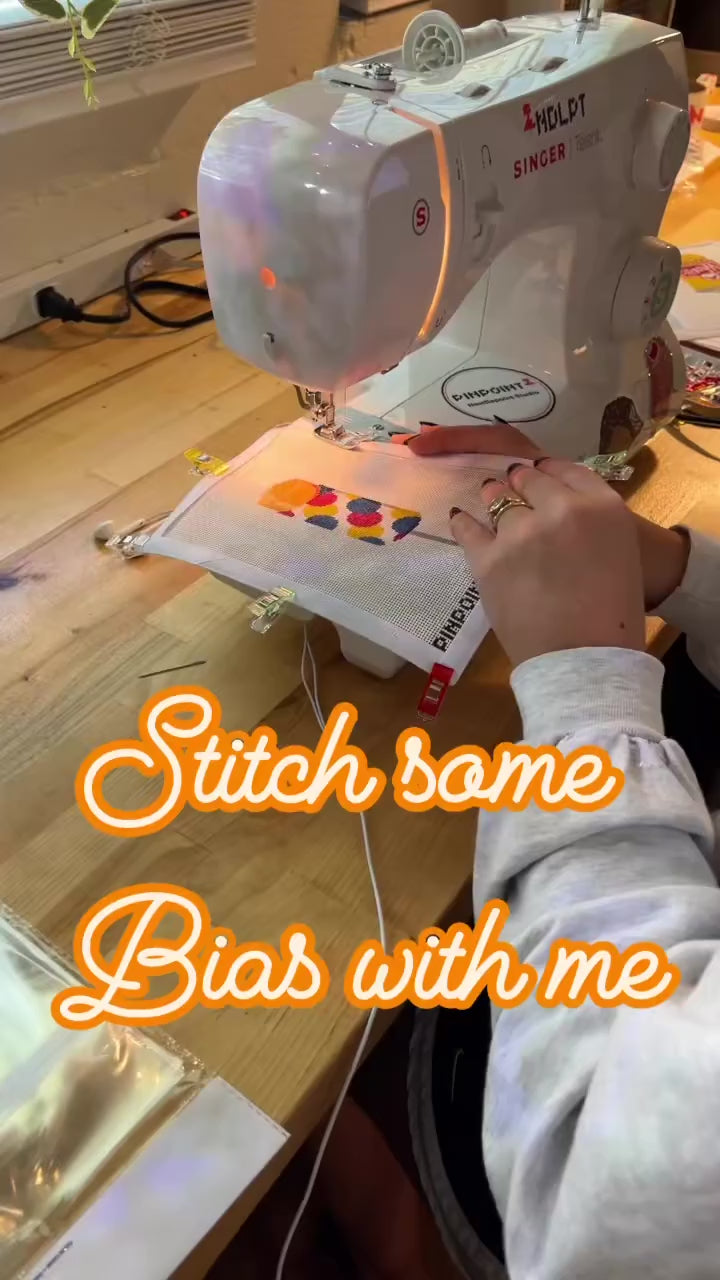 Sewing the fabric edges onto a Pinpoint canvas