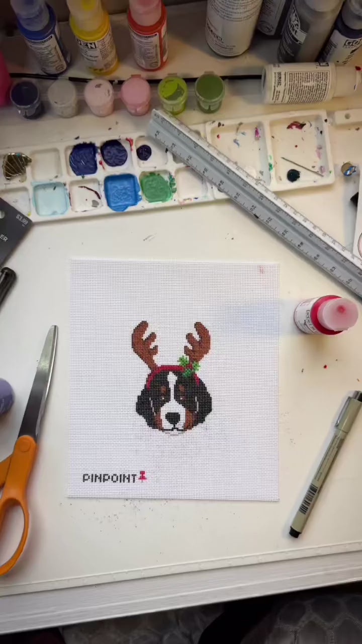 Painting a Reindeer Buddy needlepoint canvas at the Pinpoint studio